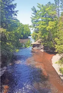  ??  ?? The Presque Isle River dumps into Lake Superior in the Porcupine Mountains.