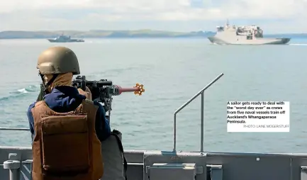  ?? PHOTO: LAINE MOGER/STUFF ?? A sailor gets ready to deal with the ‘‘worst day ever’’ as crews from five naval vessels train off Auckland’s Whangapara­oa Peninsula.