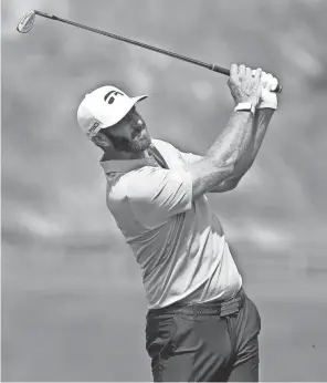  ?? BILL STREICHER/USA TODAY SPORTS ?? Dustin Johnson plays from the fairway on the second hole during the final round of the Travelers Championsh­ip on Sunday.