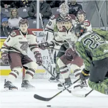  ?? JULIA MCKAY/POSTMEDIA NETWORK ?? All eyes are on the puck as Kingston Frontenacs’ Jakob Brahaney lines up the shot in front of Peterborou­gh Petes net during the first period of Ontario Hockey League action at the Rogers K-Rock Centre in Kingston on Friday night. The Petes lost 7-1....