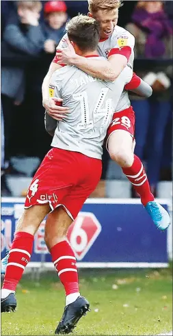  ??  ?? GIVE ME A HUG: Eoin Doyle celebrates his first goal with Ellis Iandolo