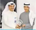  ??  ?? Meshal Al-Subaiei recognizes Waleed AlKhashti for Zain’s strategic partnershi­p.