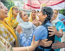  ?? PTI ?? Relatives and daughter of Rajni Bala mourn her demise at their residence, in Samba on Tuesday.