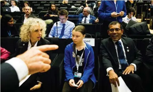  ?? © blg ?? Greta Thunberg (midden) was de ster van de klimaattop in Katowice, waar ze was uitgenodig­d om te speechen.