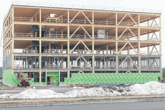  ?? MITCHELL FERGUSON • CAPE BRETON POST ?? A five-story commercial building under constructi­on at the back of the Seventh Exchange retail district in Membertou. Nova Scotia’s GDP grew 1.5 per cent in 2023 and is projected to grow by 1.2 per cent in 2024.