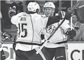  ?? ANDREW NELLES / THE TENNESSEAN ?? Nashville Predators center Colton Sissons celebrates his goal with right wing Craig Smith (15) in the second period of Game 2 in their first-round playoff series at the United Center on Saturday in Chicago.