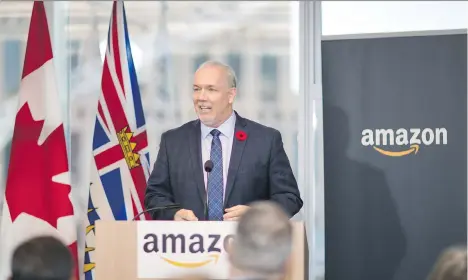  ?? FRANCIS GEORGIAN ?? Premier John Horgan touts Amazon’s plan to double its operations in Vancouver on Friday.
