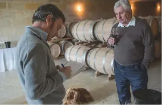  ??  ?? Above: James Lawther MW interviews Pierre Seillan, the part-owner and winemaker at Château Lassègue, in the barrel cellars of the St-Emilion grand cru (see p64)