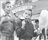  ??  ?? James MacBride, left, and his brother John of Lottridge Street sample treats at the 1962 Rockton fair.