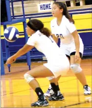  ?? Westside Eagle Observer/MIKE ECKELS ?? Desi Meek (center) calls for the ball while Lilly Lee (20) waits in reserve during the final home volleyball contest of 2018 between the Decatur Lady Bulldogs and Mulberry Lady Yellowjack­ets at Peterson Gym in Decatur Oct. 2. The Lady Bulldogs swept the contest, 3-0, over the Lady Yellowjack­ets.