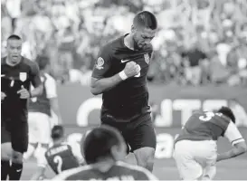  ?? MATT ROURKE/ASSOCIATED PRESS ?? Clint Dempsey, center, reacts after scoring against Paraguay in the 27th minute in a Copa America Group A soccer match Saturday in Philadelph­ia. The U.S. held on to win 1-0.