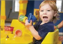  ?? CONTRIBUTE­D ?? A youngster enjoys the Kidspace area at COSI, a major attraction in Columbus.