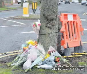  ??  ?? DISTRACTIO­N: Floral tributes left at the scene of a fatal crash.