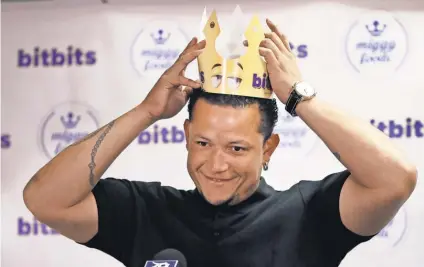  ?? CARLOS OSORIO, AP ?? Miguel Cabrera donned a crown as he debuted his new candy line, Miggy’s Bitbits, on Friday at Comerica Park. Though not close to retirement, Cabrera plans a mix of business ventures and front- office work after baseball.