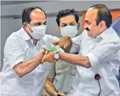  ?? - PTI ?? Senior Congress MLA K.Babu (L) felicitate­s V.D. Satheesan at a press meet in Kochi on Saturday.