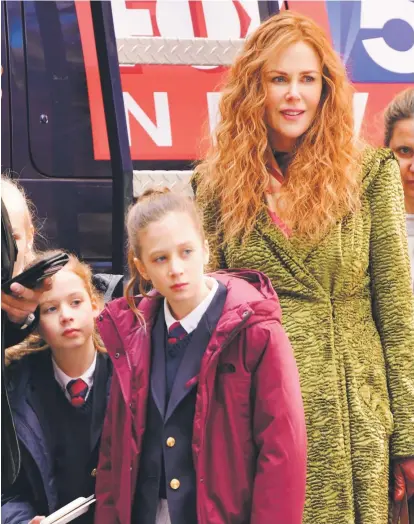  ??  ?? Family affair: Nicole Kidman with her daughters Faith, 9, and Sunday, 12, who make cameos in TheUndoing.