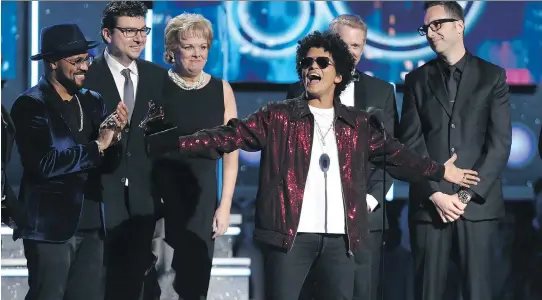  ?? MATT SAYLES/THE ASSOCIATED PRESS ?? Bruno Mars’ 24K Magic was golden at the Grammys on Sunday in New York. The R&B singer claimed the most trophies for the album and its hits.