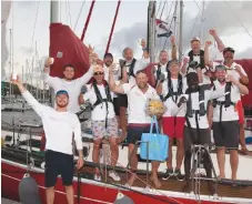  ??  ?? Ross Applebey (centre) and crew of Scarlet Oyster celebrate Ross’s fourth racing division win, the third consecutiv­ely