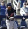  ?? CARLOS OSORIO — ASSOCIATED PRESS ?? Francisco Mejia connects for a two-run home run during a spring training game against the Brewers.