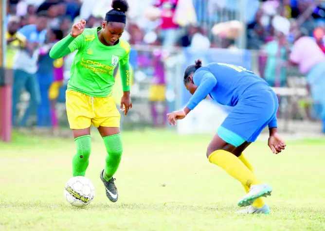  ?? GLADSTONE TAYLOR/MULTIMEDIA PHOTO EDITOR ?? Excelsior High’s Davia Richards (left) on the offence going up against Denham Town’s Tianna Beswick in the Inter-Secondary Schools Sports Associatio­n Girls Football Championsh­ip finals played on Friday May 3, 2019, at the Spanish Town Prison Oval in St Catherine. Excelsior successful­ly defended their title, winning 4-1.