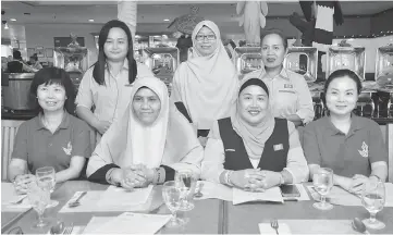  ??  ?? Irene (seated left) and Alice (seated right) with Pakatan Harapan Sarawak Women Council committee members.