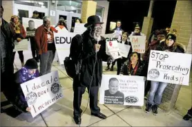  ?? Michael Henninger/Post-Gazette ?? Paradise Gray of One Hood speaks as protesters call for the firing of Woodland Hills Junior/Senior High School principal Kevin Murray. They gathered outside a school board meeting Monday.