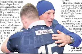  ??  ?? NOT SO STERN Cotter hugs Hogg after Wales win