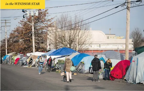  ?? BEN NELMS FOR NATIONAL POST ?? Tents line The Strip in the Vancouver suburb of Surrey. Like the Downtown Eastside, it has become a symbol of British Columbia’s opioids, housing and mental health crises.