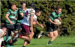  ??  ?? Te Kawau, in green, plays College Old Boys in April. Temm Kauri has the ball.