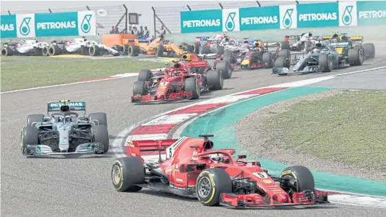  ??  ?? Formula One cars in action during a recent Grand Prix race.