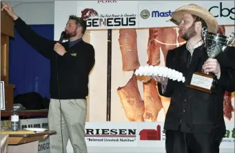  ??  ?? Egg competitio­n winner Nathan Wipf of Abbey Colony watches while auctioneer Tyler Smyth takes bids during the live auction. The eggs were sold for $500 to Masterfeed­s and the money was donated to STARS.