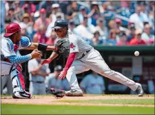  ?? NICK WASS/AP PHOTO ?? Rafael Devers, right, slides home to score past Washington catcher Pedro Severino on a sacrifice fly by Jackie Bradley Jr., during the seventh inning of Boston’s 3-0 win over the Nationals on Wednesday.