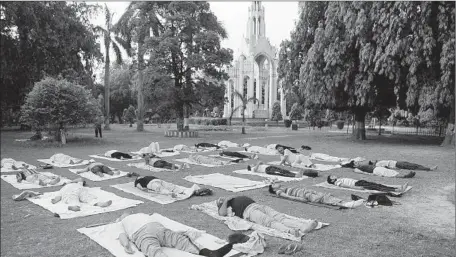  ?? Sanjay Kanojia
AFP/Getty Images ?? PEOPLE take part in a yoga workshop in Allahabad, India. The nation is sponsoring global events as part of the Internatio­nal Day of Yoga.