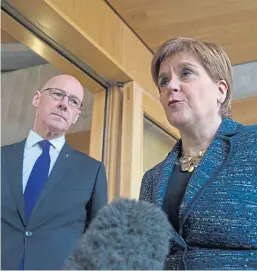  ?? Pictures: PA/Shuttersto­ck. ?? Top: Alex Salmond arrives at Edinburgh Sheriff Court after being arrested and charged by police. Above: Deputy First Minister John Swinney looks on as First Minister Nicola Sturgeon answers BBC Scotland’s questions about former first minister Alex Salmond.