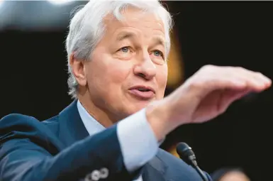  ?? SAUL LOEB/GETTY-AFP ?? JPMorgan Chase Chairman Jamie Dimon, seen Dec. 6, has called AI a revolution­ary technology that will upend jobs.