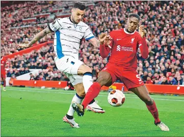  ?? AFP ?? Atalanta forward Gianluca Scamacca (L) vies with Liverpool defender Ibrahima Konate at Anfield on Thursday.