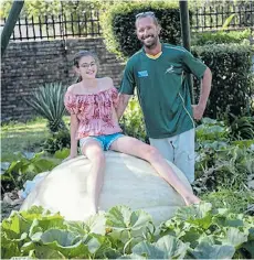  ?? Picture: SHIRAZ MOHAMED ?? SEEDS OF SUCCESS: Peet Joubert and daughter Megan with Howie the squash, which won first place at the Goliat van Gat Pumpkin Festival in Centurion on Saturday