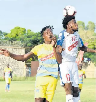  ??  ?? Portmore United’s Tevin Shaw (right) wins a header over Stephen Williams (left) of Waterhouse FC during National Premier League match on November 10, 2019.