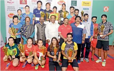  ??  ?? Winners and runners up are all smiles as they pose with their trophies in the India Internatio­nal Series badminton championsh­ip on Sunday. Also seen in the pictures are Sports Authority of Telangana State officials.