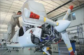  ?? ZHANG BINBIN / FOR CHINA DAILY ?? A worker from an aircraft manufactur­er assembles an airplane in Binzhou, Shandong province, in March. Experts say the new pilot requiremen­ts will encourage more people to take up flying.