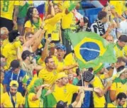  ?? AFP ?? Brazilian fans were in a buoyant mood after Philippe Coutinho gave the lead but Switzerlan­d’s equaliser stunned them into silence.