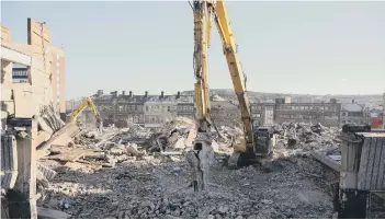  ??  ?? Heavy machines move in to clear the site