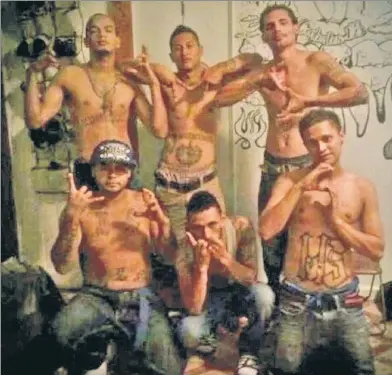  ??  ?? WRONG CROWD: Brooklyn federal prosecutor­s say this photo of Marcelo “Profugo” Esquivel (back row middle) in a group flashing MS-13 gang signs is proof he ordered the 2012 killing of a rival gangster in Queens.