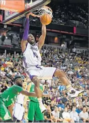  ?? Ethan Miller Getty Images ?? DUNKING against the Celtics, David Nwaba says he has to be aware that Lonzo Ball will find him.