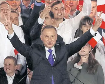  ?? REUTERS ?? Polish President Andrzej Duda gestures after the announceme­nt of voting results in Pultusk on Sunday.