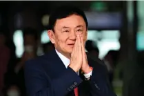  ?? AFP FILE PHOTO ?? HOME AT LAST
Thailand’s former prime minister Thaksin Shinawatra greets his supporters after landing at Don Mueang Internatio­nal Airport in the capital Bangkok on Aug. 22, 2023.
