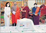  ?? PTI ?? Bhutan PM Lotay Tshering (2nd from right) on the arrival of a consignmen­t of Covid-19 vaccine in Bhutan.