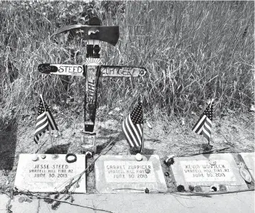  ?? Associated Press ?? Memorial stones are shown June 3 at the Wildland Firefighte­rs Monument at the National Interagenc­y Fire Center in Boise, Idaho, for wildland firefighte­rs killed by a wildfire on June 30, 2013, near Yarnell, Ariz. Federal officials at the NIFC are bolstering mental health resources for wildland firefighte­rs following an apparent increase in suicides.