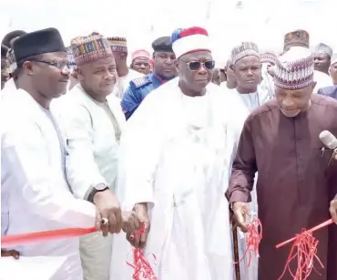  ?? PHOTO: MNAN ?? Chairman, Biu Local Government Area, Borno, Mr Ali Dikwa (R) inaugurati­ng road project at Nigeria Army University in Biu Local Government Area of Borno on Saturday. With him are: Emir of Biu, Alhaji Umar Mustapha-Aliyu (2nd R); Vice Chancellor of the University, Prof. David Malgwi (L) and others.