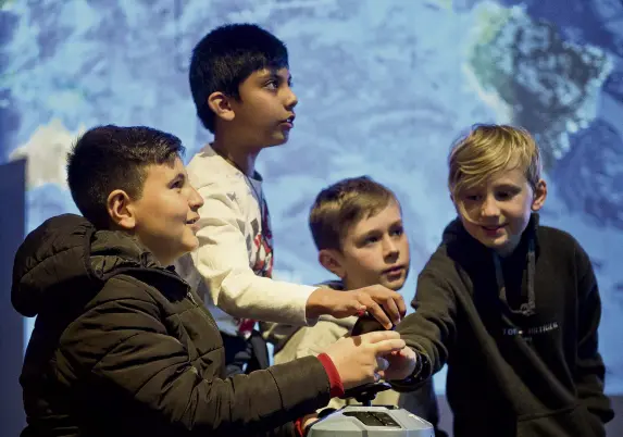  ?? PHOTOS: GERARD O'BRIEN ?? We have liftoff . . . Flying a space shuttle at the Aotearoa in Space science showcase at Otago Museum are George Street Normal School pupils (from left) Abdul Hadi (9), Aman Jesly (9), Harper McElligot (11) and Charlie O'Neill (9).